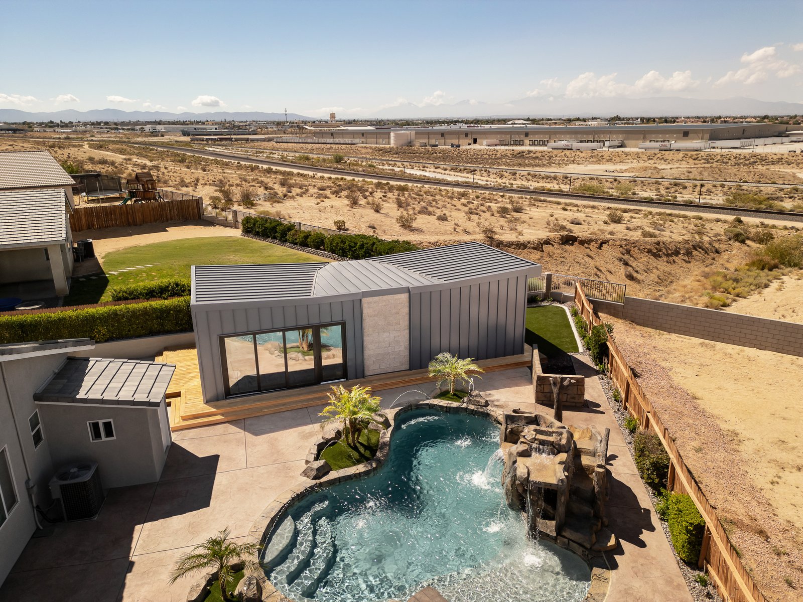 ADU Completed - Wider aerial view with pool and landscaping